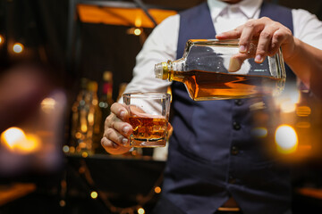 Bartender pouring Whiskey, on  bar,