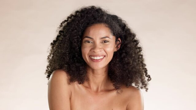 Skincare, beauty and face of a woman in a studio with a natural, cosmetic and facial treatment. Happy, wellness and portrait of a female model from Mexico with health skin routine by brown background