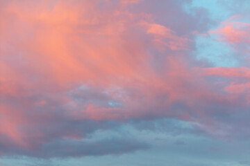 Colorful clouds in the sky at sunset. Background