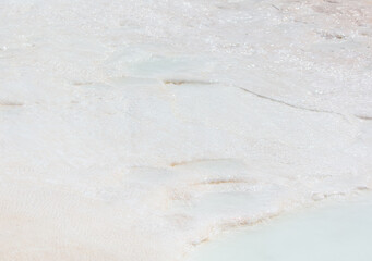 Emerald water in white limestone rock.