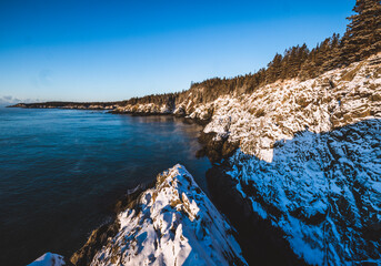 A snowy, cold sunrise along the rocky Atlantic coast, Cutler, Maine