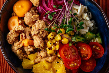 hawaiian poke bowl with chicken, vegetables, rice