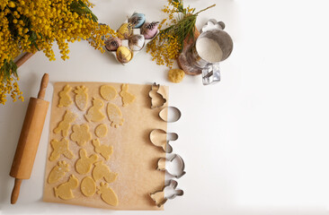 Raw Easter cookies on baking paper top view