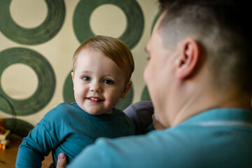 portrait of a little boy who looks into the camera and smiles. children's portrait. children's day