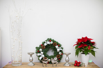 Christams decoration on a wooden shelf in a room at home.