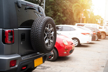 Car spare tire, spare wheel or off-road rear tire Parked in a shopping mall in Laos, Asia