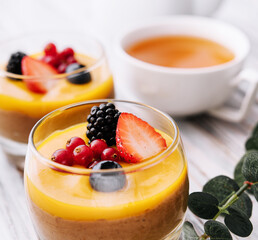 Delicious panna cotta with mango with berries