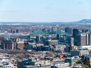 Fototapeta premium Montreal city scape with the iconic Jacques Cartier Bridge in the background on a winter morning - Close-up