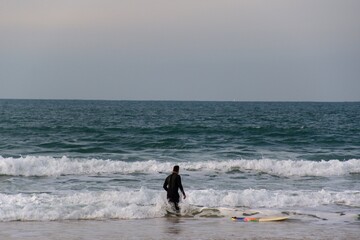 Fototapeta na wymiar surfer on the beach