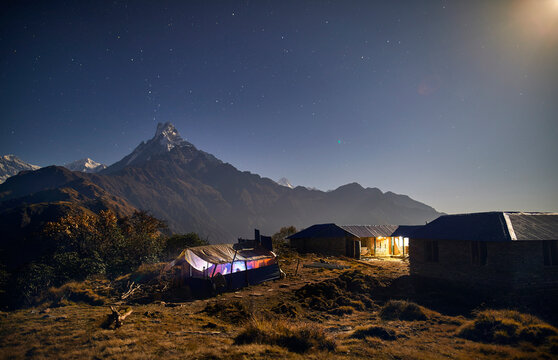 Lodge son mountain against sky at night