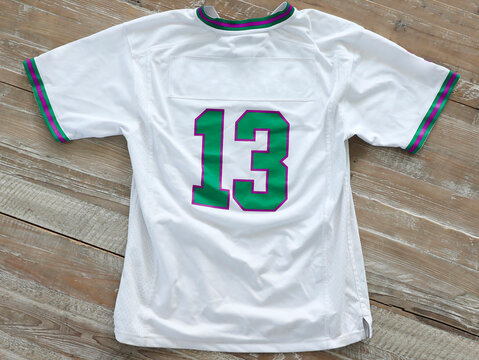 High angle view of t-shirt with number 13 on wooden table
