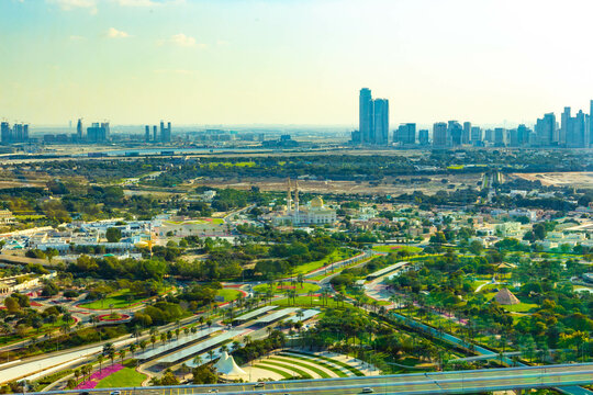 view of dubai city park in the foreground modern buildings in the background