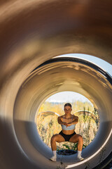 Obraz na płótnie Canvas Stunning fit lady doing squats