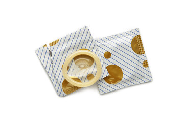Condoms isolated on white background. A condom use to reduce the probability of pregnancy or...