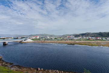 Naklejka na ściany i meble fishing village Teriberka, Kola Peninsula, Murmansk region, Russia. general view of the northern village in summer