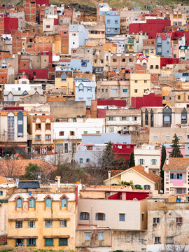 Dense and colorful city scape seen in the old city of Azrou, Morocco on a cloudy morning - Portrait Shot