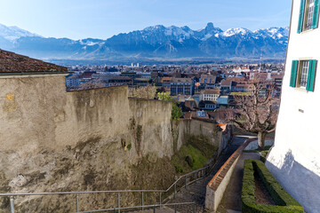 Castle hill at the old town of City of Thun with stone wall and beautiful panorama of the Swiss Alps on a sunny winter day. Photo taken February 21st, 2023, Thun, Switzerland.