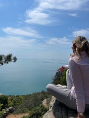 woman sitting on the rocks