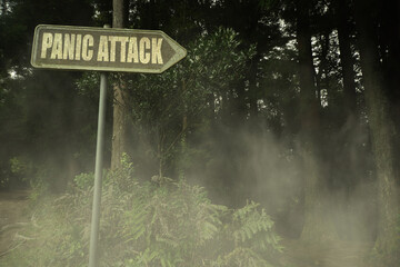 old signboard with text panic attack near the green sinister forest
