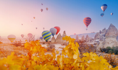 Landscape sunrise in Cappadocia with set colorful hot air balloon fly in sky with sun light....