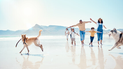 Family, beach and parents with children and dogs for bonding, quality time and adventure together. Travel, pets and happy mom, dad and kids enjoy summer holiday, vacation and relax on weekend by sea