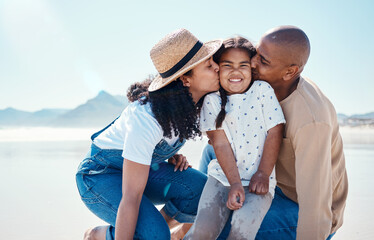 Obraz premium Black family, children and beach with parents kissing their daughter outdoor in nature on the sand by the ocean. Kids, love or summer with a mother and father giving a kiss to their female child
