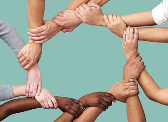 People, diversity and hands together in teamwork collaboration for trust against a studio...