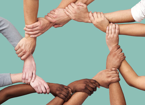 People, diversity and hands together in teamwork collaboration for trust against a studio background. Diverse group holding hand in unity or solidarity for community or agreement in circle on mockup - Powered by Adobe