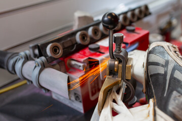 Orange metal sparks coming from sharpening ice skates
