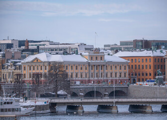 Naklejka premium The Foreign Ministry Apartment house, the bay Strömmen with two bridges, a snowy day in Stockholm