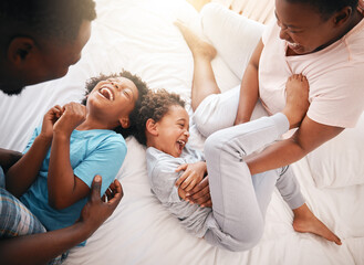 Tickle, funny and relax with black family in bedroom for bonding, playful and affectionate. Laugh, happiness and crazy with parents playing with children at home for wake up, morning and silly - obrazy, fototapety, plakaty