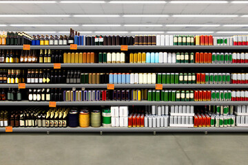 Beer bottles and cans on shelf 

Suitable for presenting new beer bottles and packaging or label designs among many others.