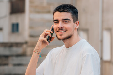 young teenager on the street talking on the mobile phone