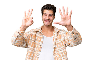 Young handsome caucasian man over isolated background counting eight with fingers