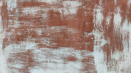 A metal plate with red rust and white paint. Background and texture