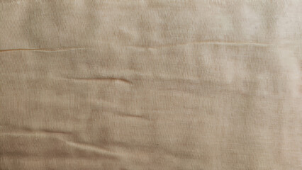 Fototapeta premium Abstract background and texture from yellow linen fabric, made from linen fibers