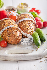 Delicious ingredients for sandwich with measure tape.