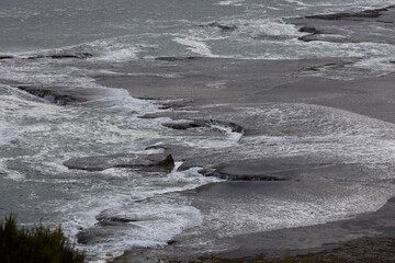 Rock platform on the beach shore.
