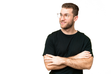 Young handsome blonde man over isolated chroma key background looking to the side and smiling