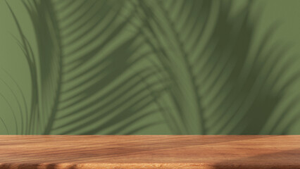 Wooden table with green stucco wall background with window light and palm leaves shadow. Product presentation mock up. Empty interior design concept
