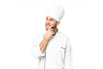 Young blonde man Chef over isolated chroma key background thinking an idea while looking up