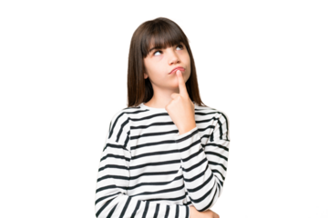 Little caucasian girl over isolated background having doubts while looking up