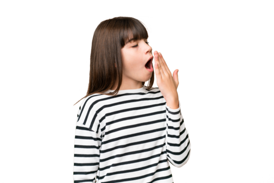 Little caucasian girl over isolated background yawning and covering wide open mouth with hand