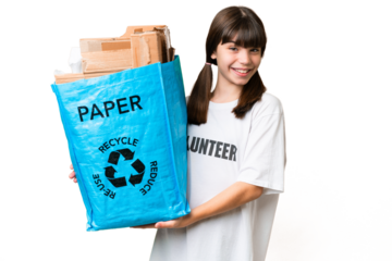 Little Caucasian girl holding a recycling bag full of paper to recycle over isolated background with happy expression
