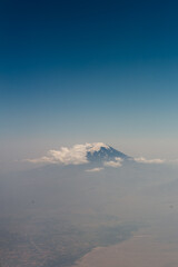 Top of Mount Ararat (Turkey) from the airplane window in the clouds. Yerevan, Armenia. Mountain