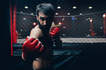 MMA Fighter Preparing red gloves for training before sparring