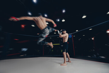 MMA Boxers fighters in fights without rules in ring octagon, motion blur, dark background