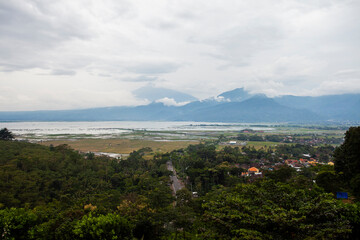 Obraz premium View of the Rawa Pening lake seen from a height. Viewed from the Eling Bening tourist area. Lake Rawa Pening is located in the Ambarawa area, Semarang Regency, Central Java, Indonesia.