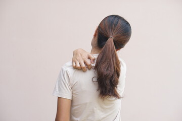 Asian woman having back itching