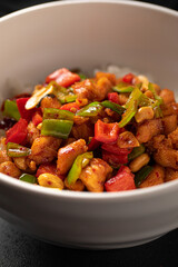 Portion of chinese gong bao chicken with rice and peanuts
